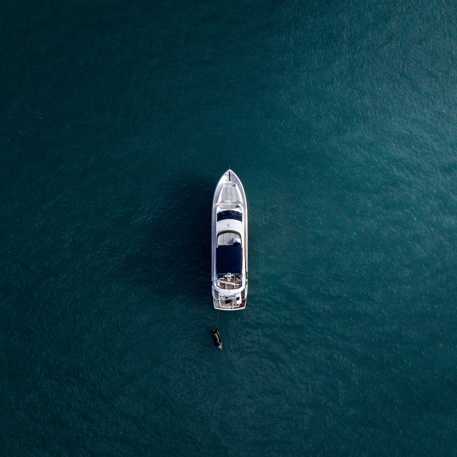 Aerial view of luxury yacht on open ocean — Verra Marketing Agency